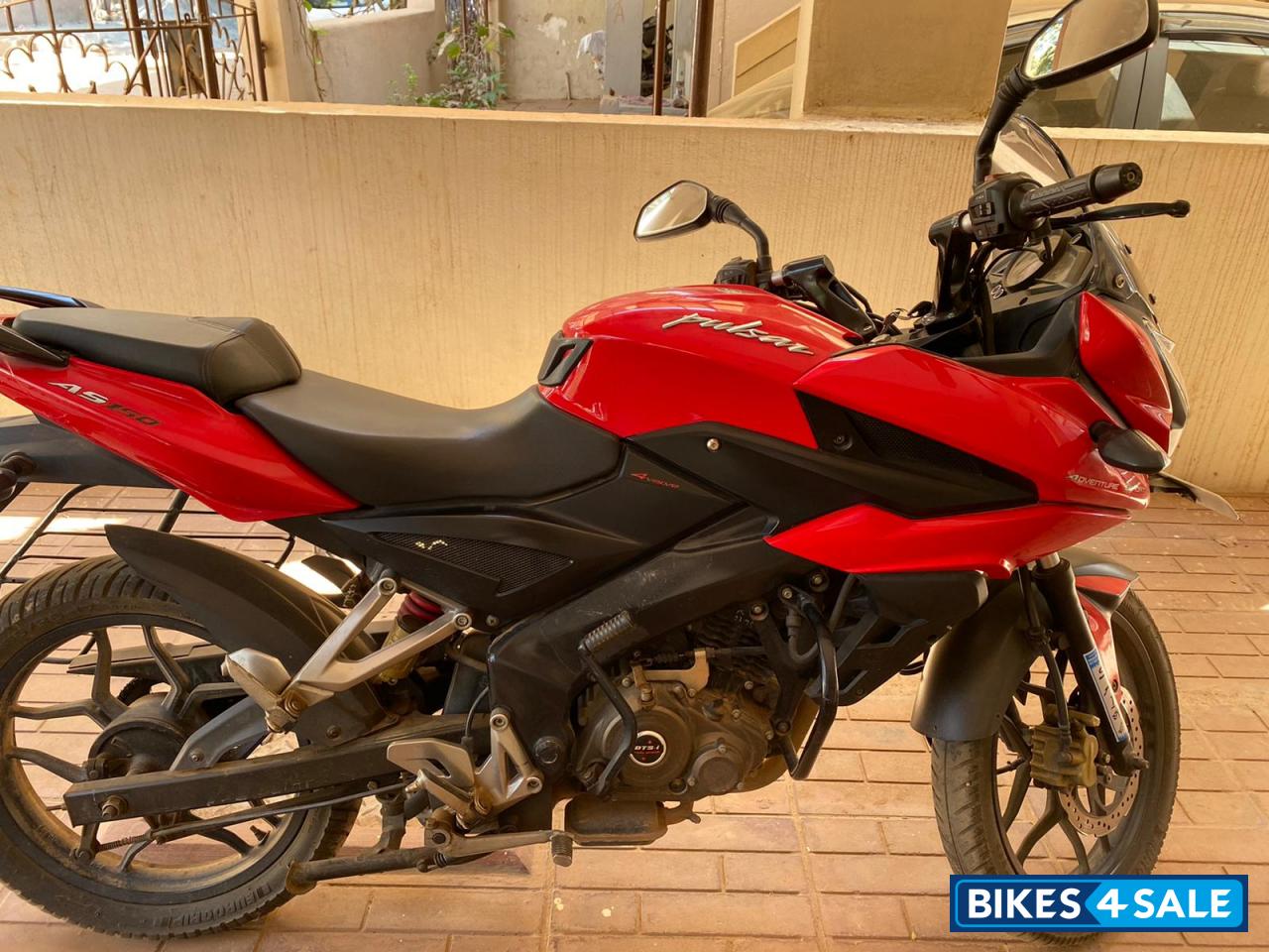Red Bajaj Pulsar AS 150