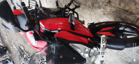 Red Bajaj Pulsar AS 150