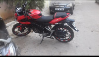 Red Bajaj Pulsar AS 150