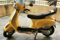 Yellow Vespa LX 125