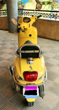 Yellow Vespa LX 125