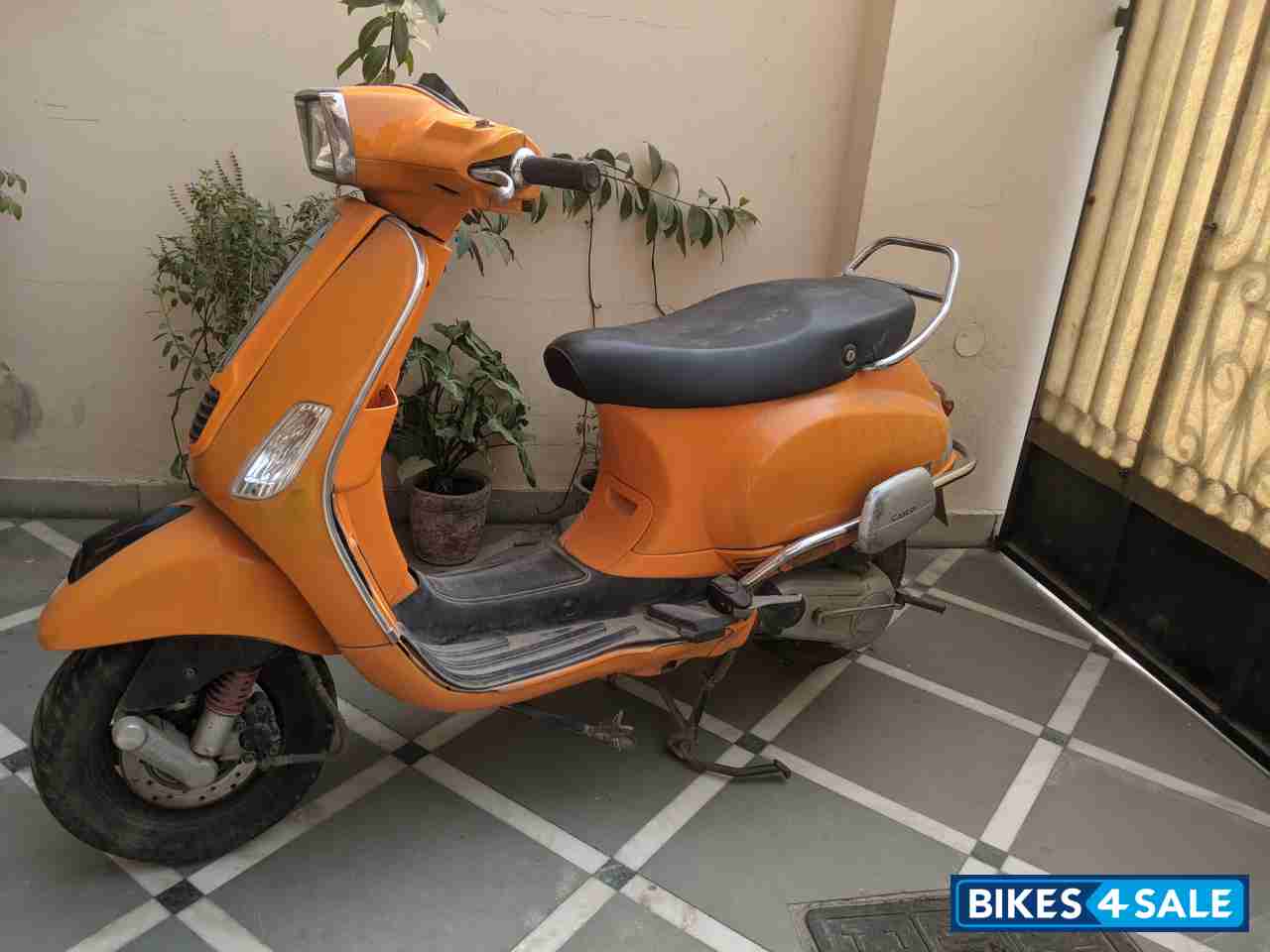 Orange Vespa 125