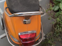 Orange Vespa 125