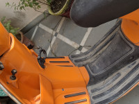 Orange Vespa 125