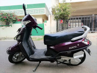 Magnetic Magenta Mahindra Gusto