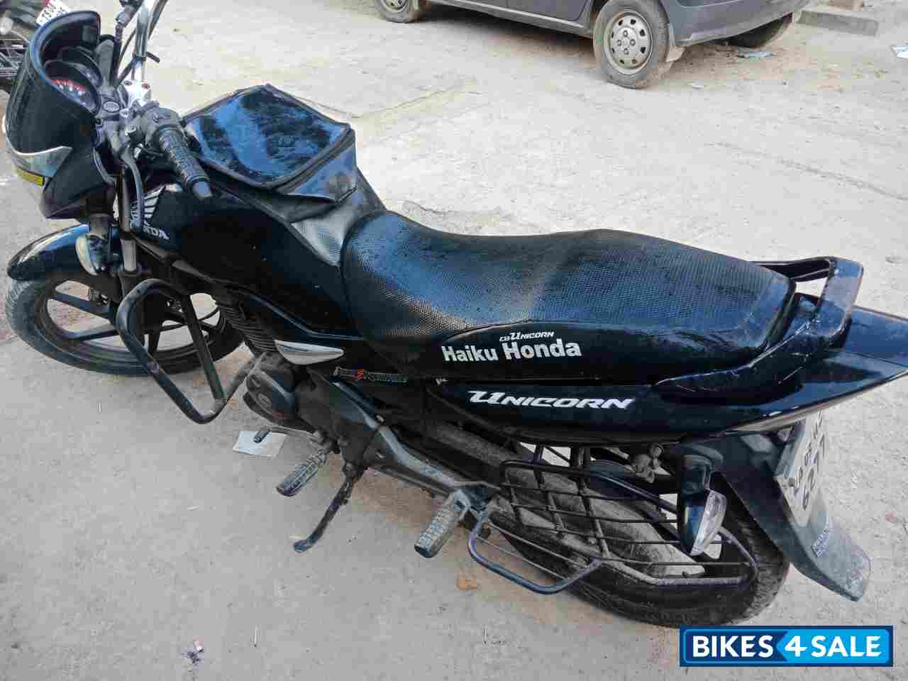 Black-silver Honda Unicorn