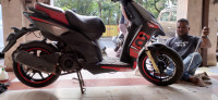 Black Aprilia SR 150