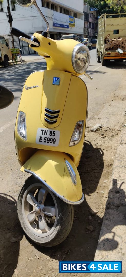 Yellow Vespa VXL 150