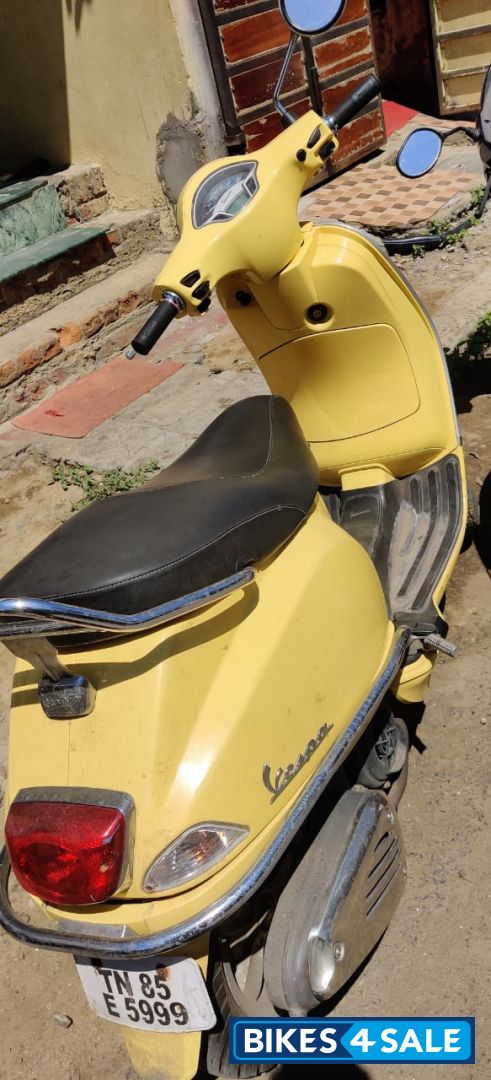 Yellow Vespa VXL 150