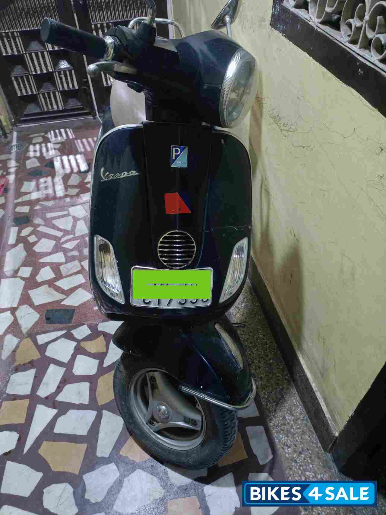 Blue Vespa VX 125