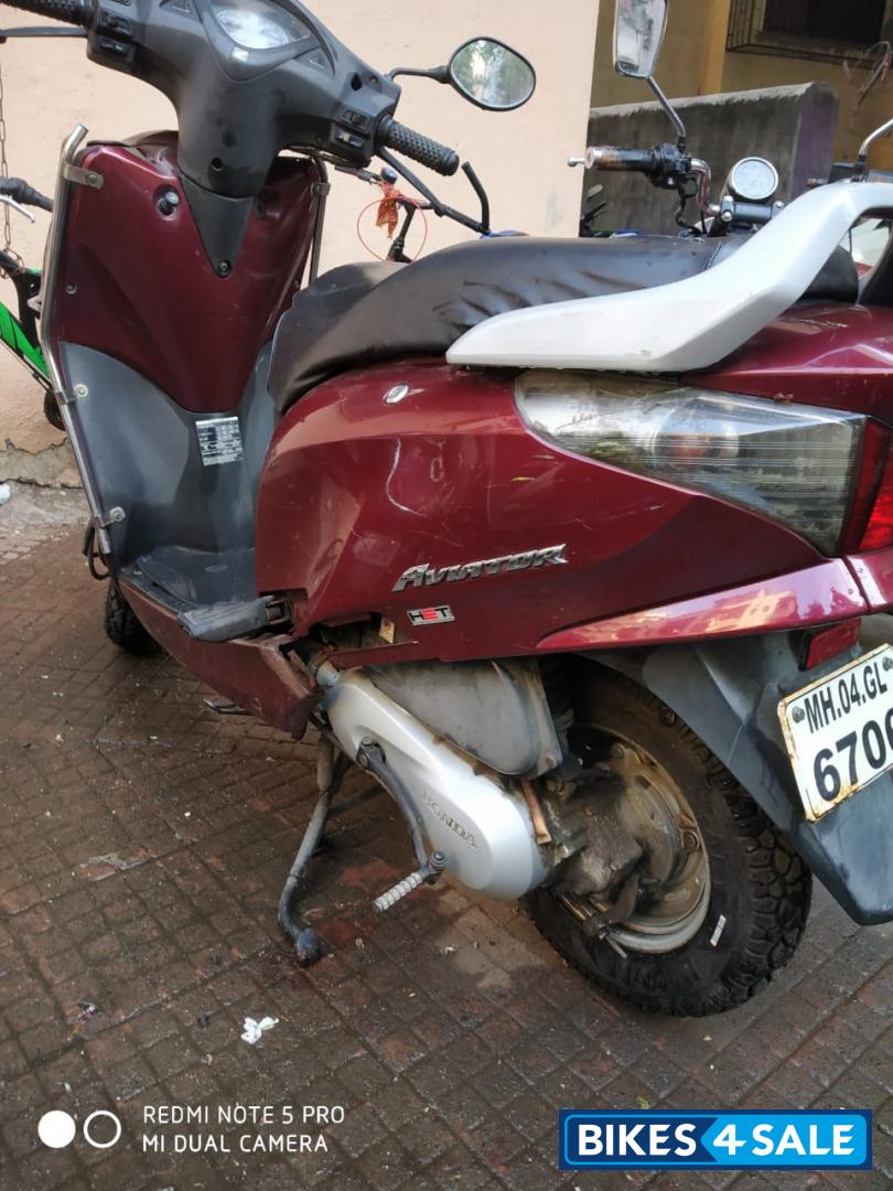 Maroon Honda Aviator