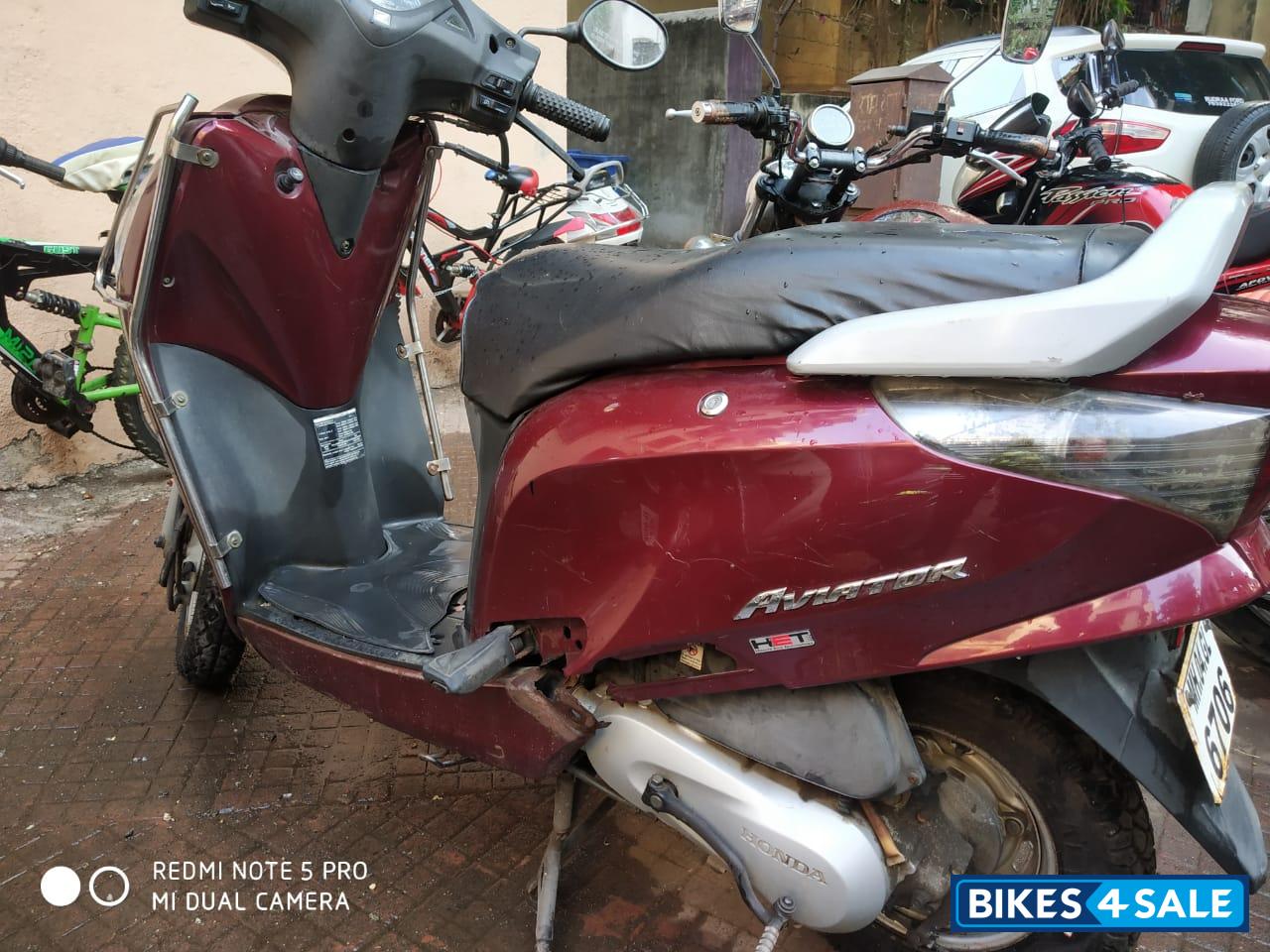 Maroon Honda Aviator
