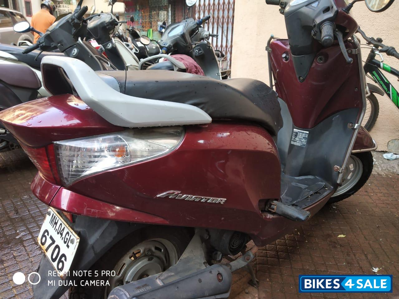 Maroon Honda Aviator