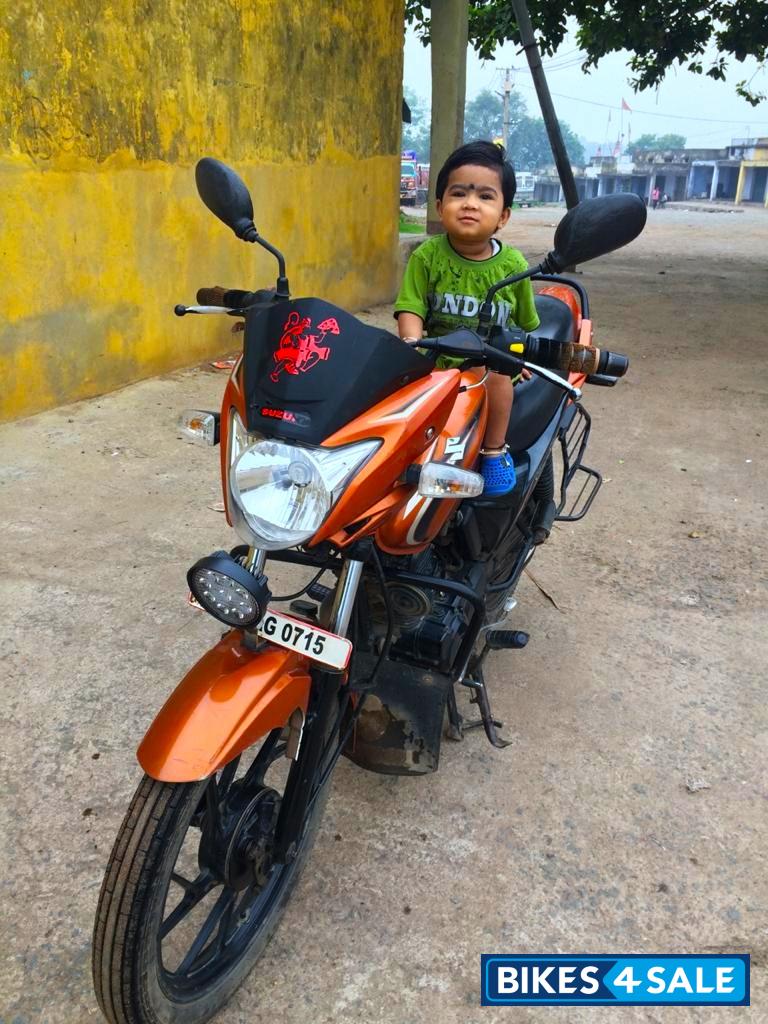 Yellowish Orange Suzuki SlingShot Plus