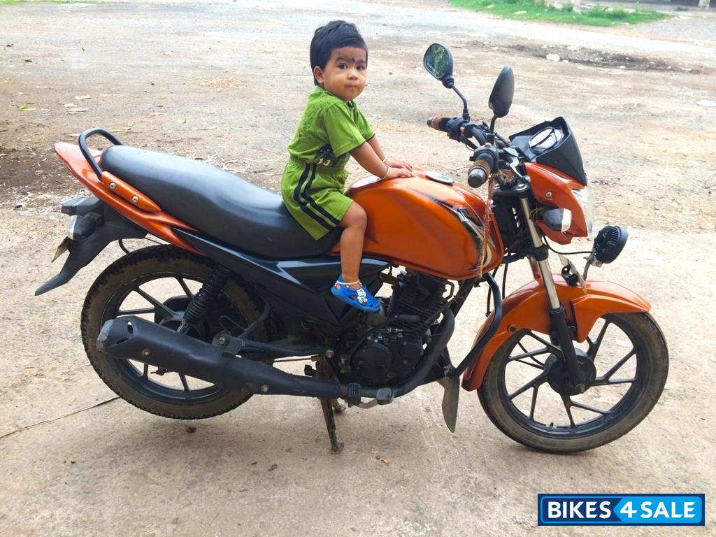 Yellowish Orange Suzuki SlingShot Plus