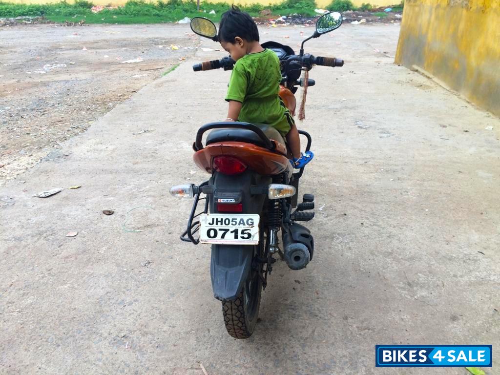 Yellowish Orange Suzuki SlingShot Plus