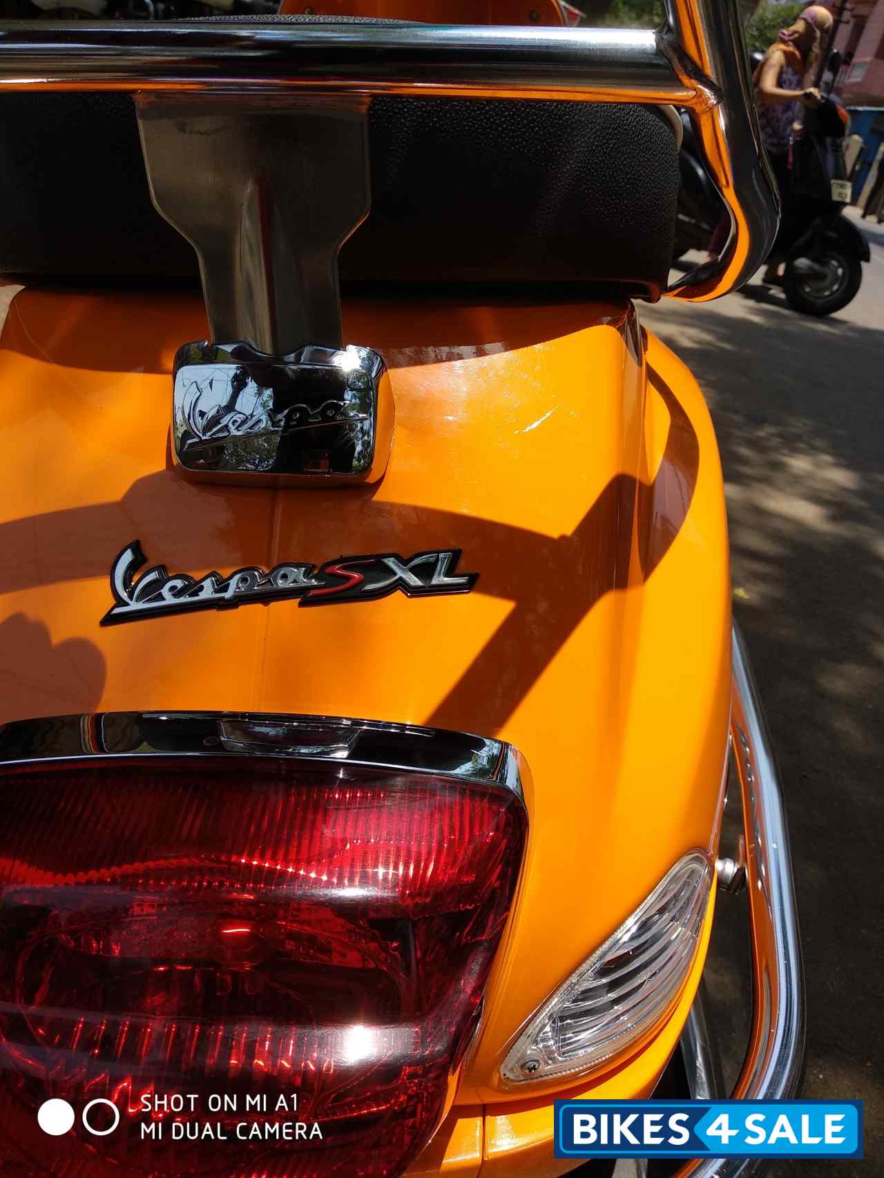 Orange Vespa SXL 125