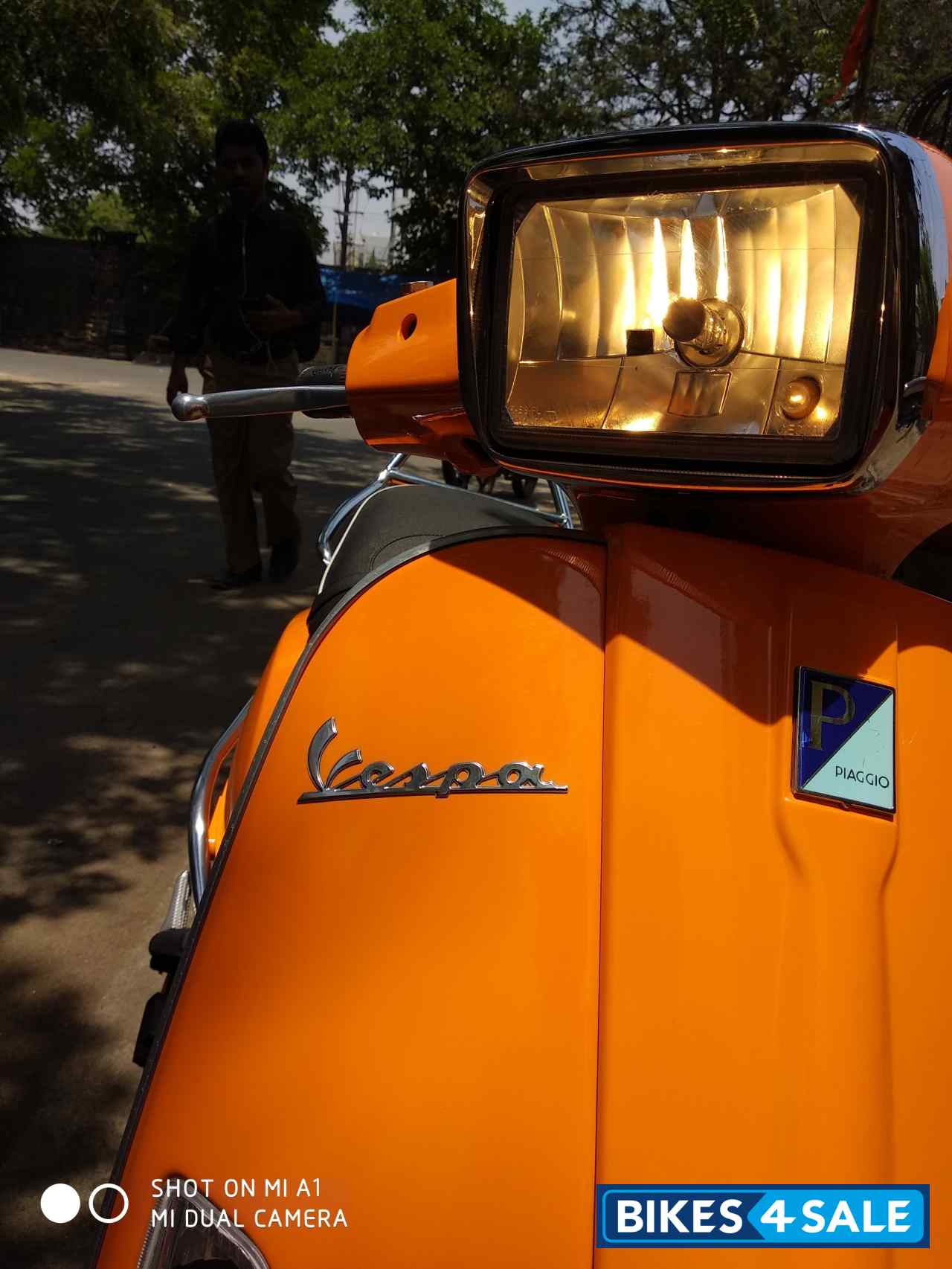 Orange Vespa SXL 125