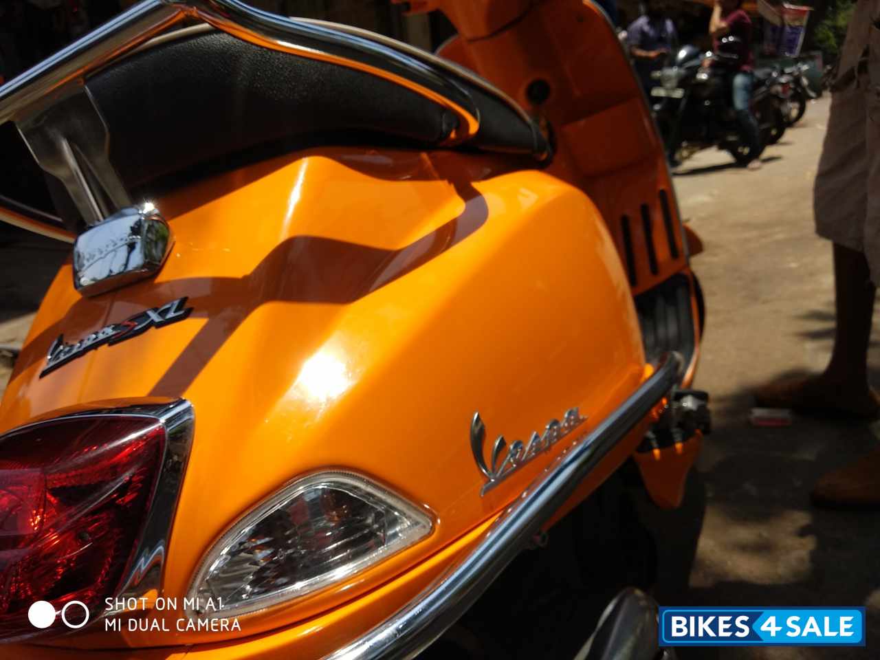 Orange Vespa SXL 125