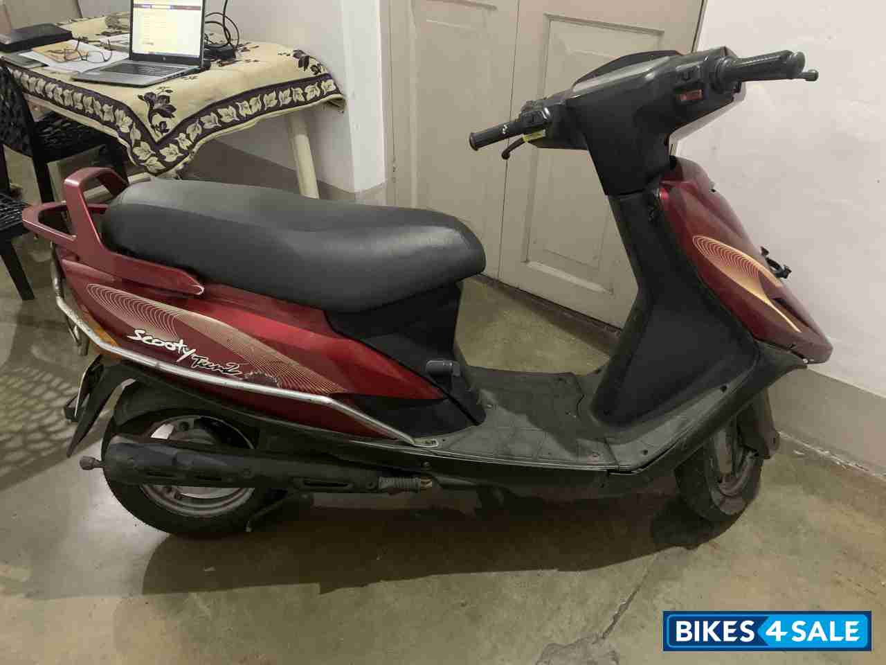 F. Red TVS Scooty Teenz