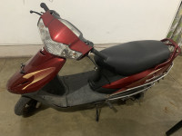 F. Red TVS Scooty Teenz