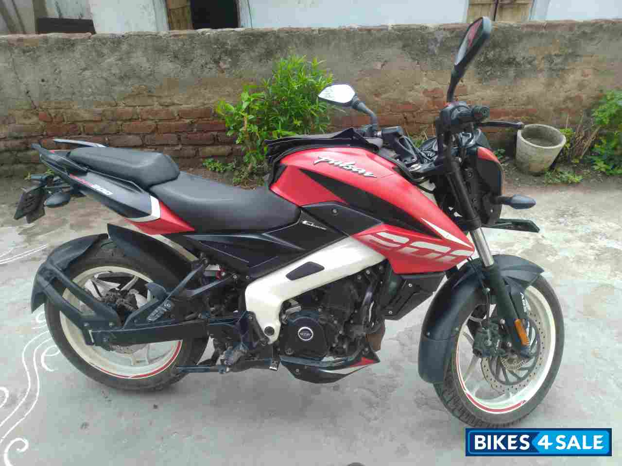 Red And White Bajaj Pulsar 200 NS ABS