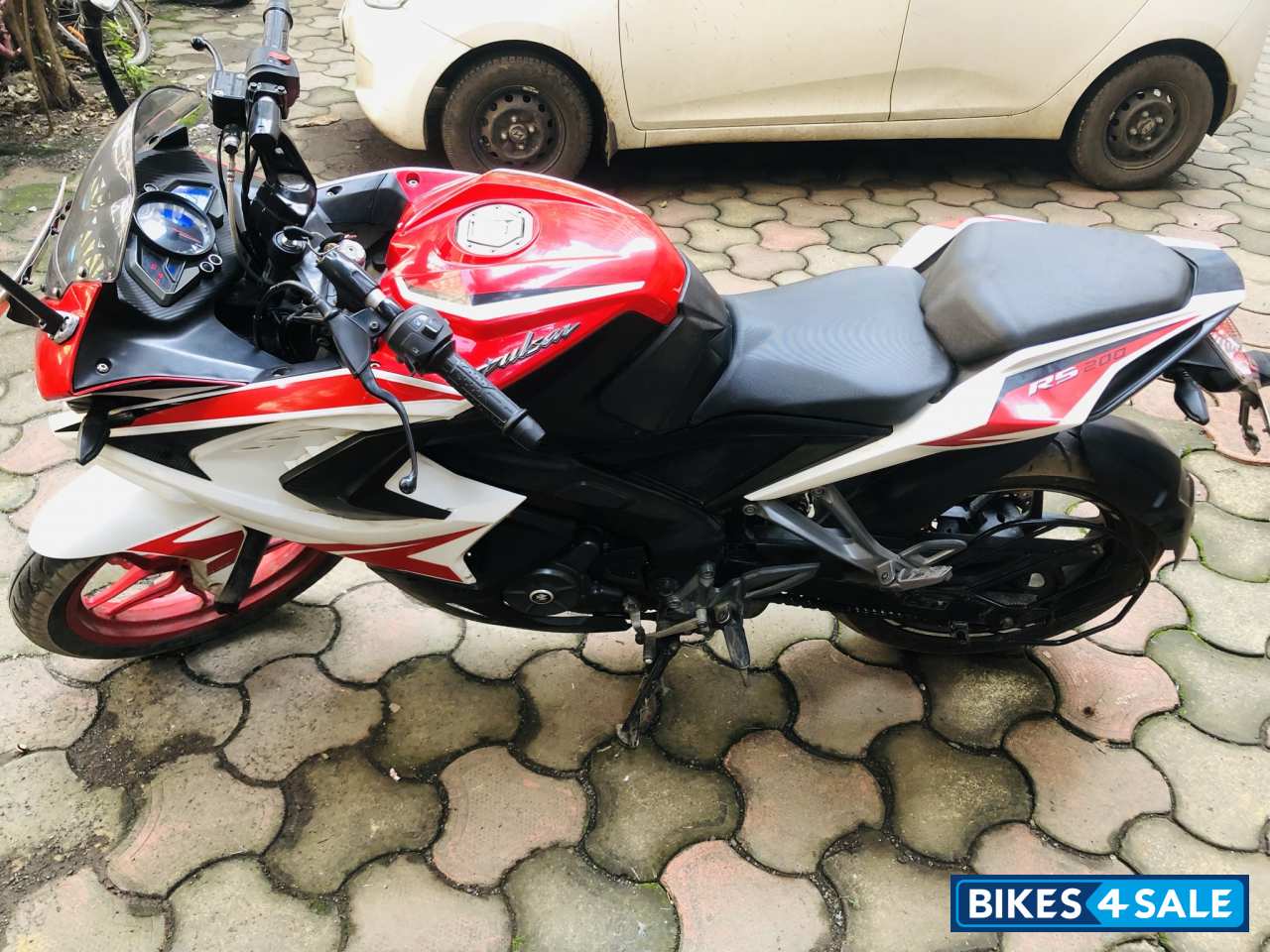 Red And White Bajaj Pulsar RS 200 ABS