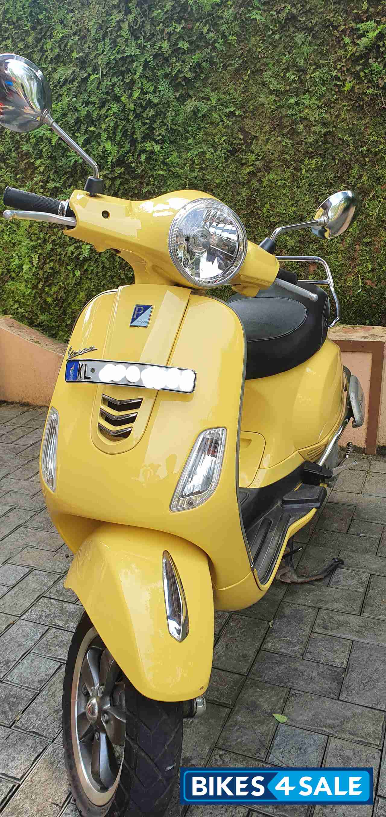 Yellow Vespa VXL 150
