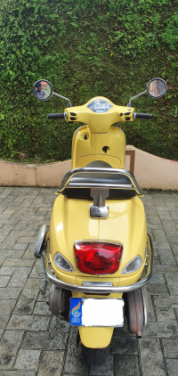 Yellow Vespa VXL 150
