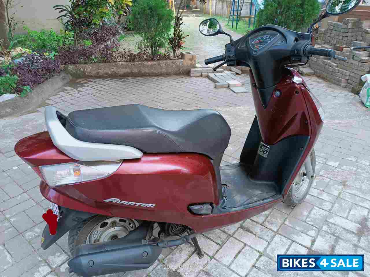 Maroon Honda Aviator