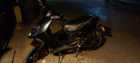 Black Aprilia SR 150