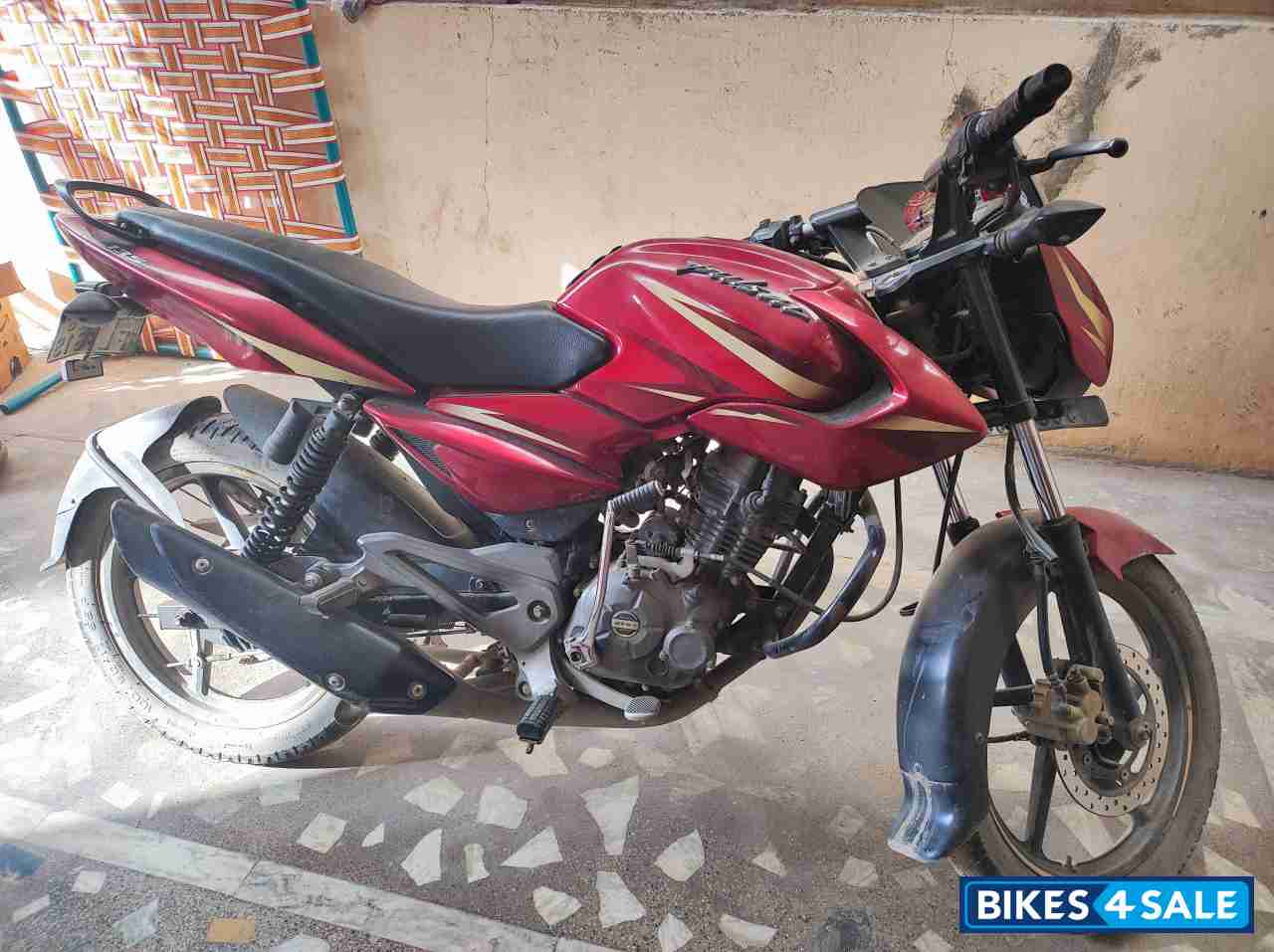 Red Bajaj Pulsar 135LS