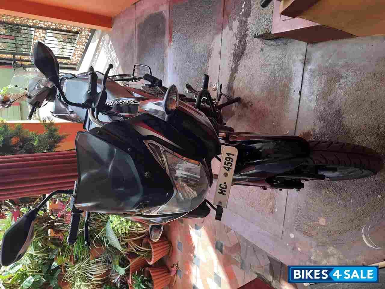 Black & Red Bajaj Discover 150 F