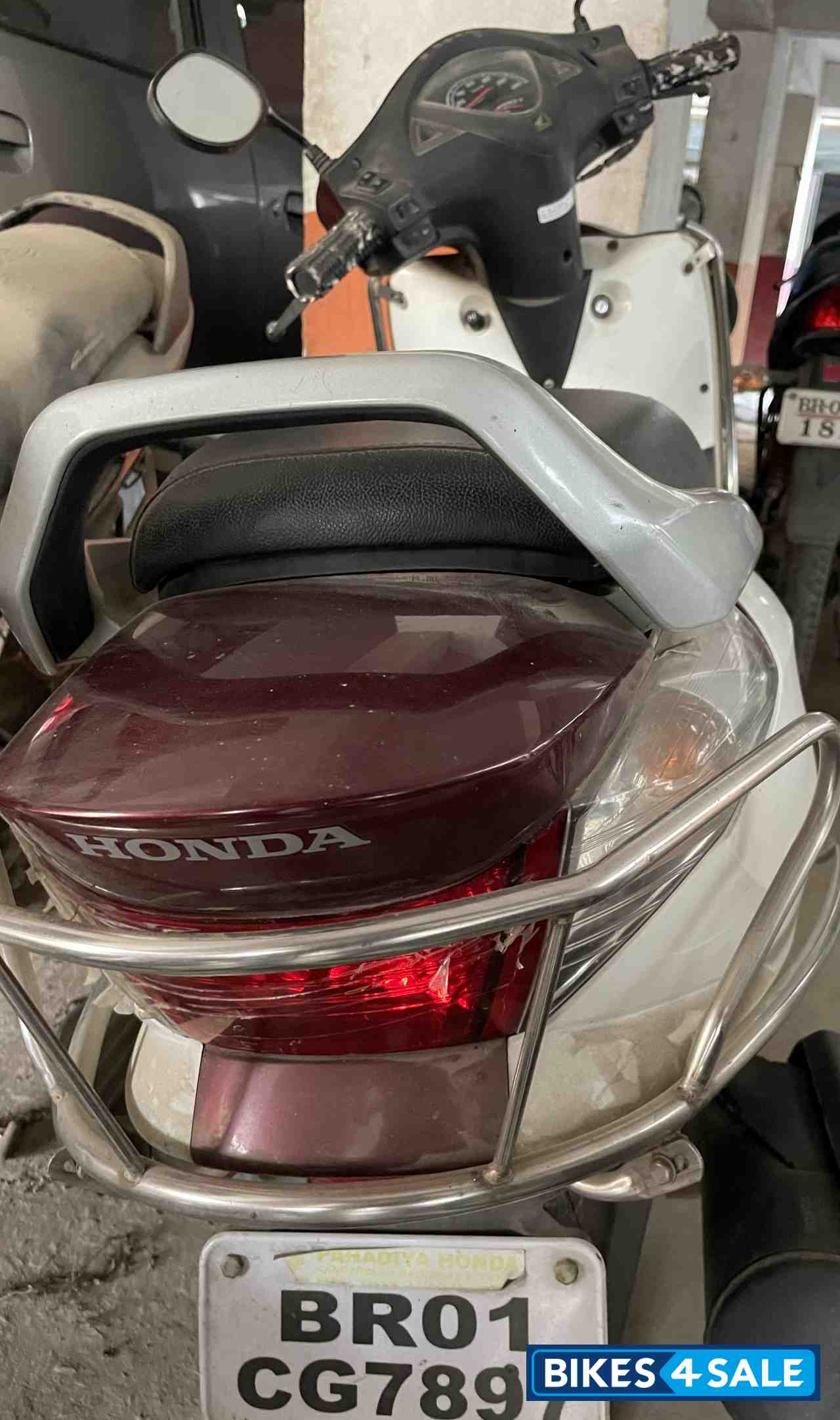 White With Maroon Honda Aviator