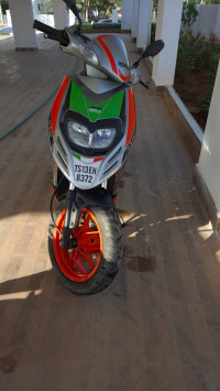 Red Aprilia SR 150 Race