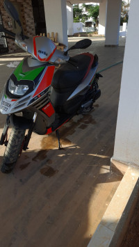 Red Aprilia SR 150 Race