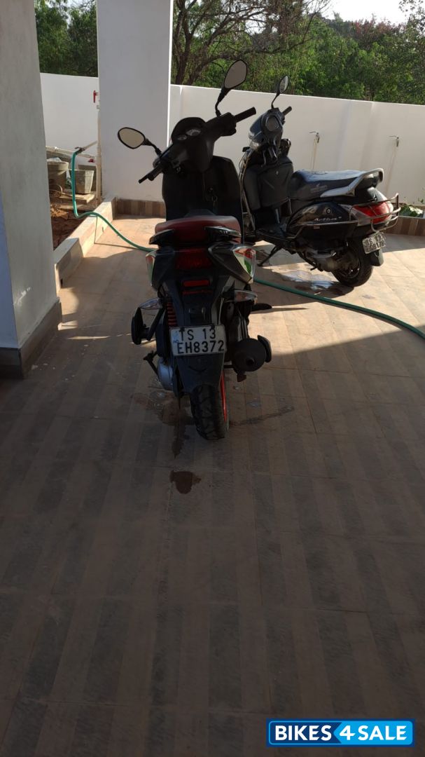 Red Aprilia SR 150 Race