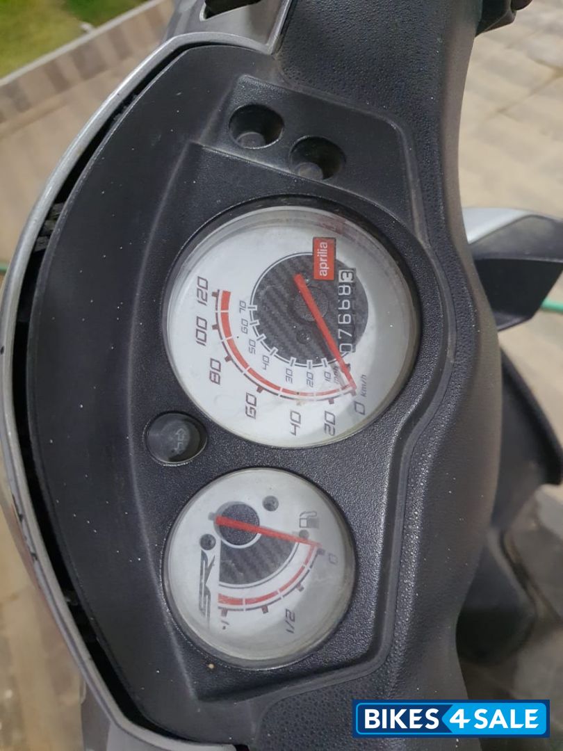 Red Aprilia SR 150 Race