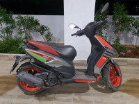 Red Aprilia SR 150 Race