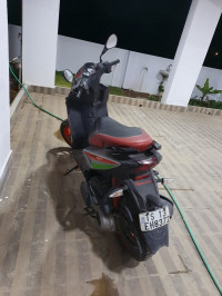 Red Aprilia SR 150 Race