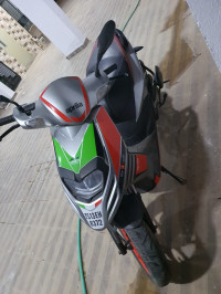 Red Aprilia SR 150 Race