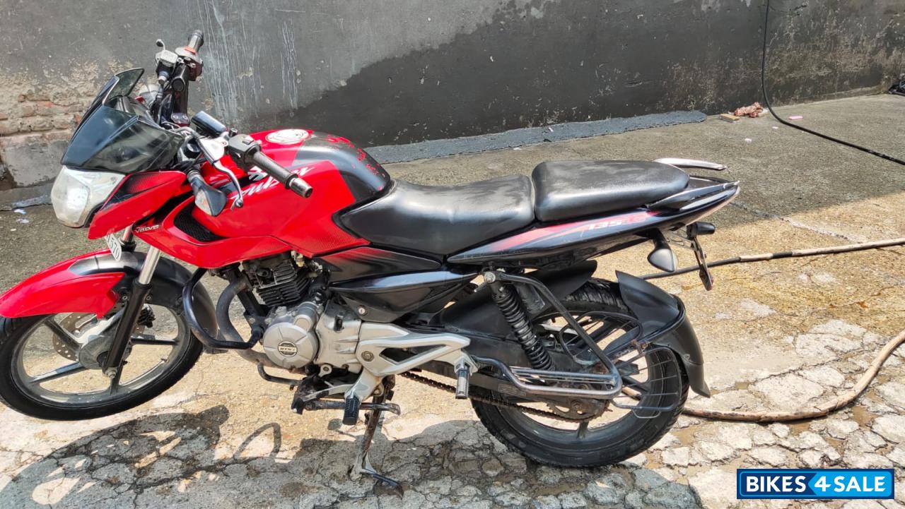 Red-black Bajaj Pulsar 135LS