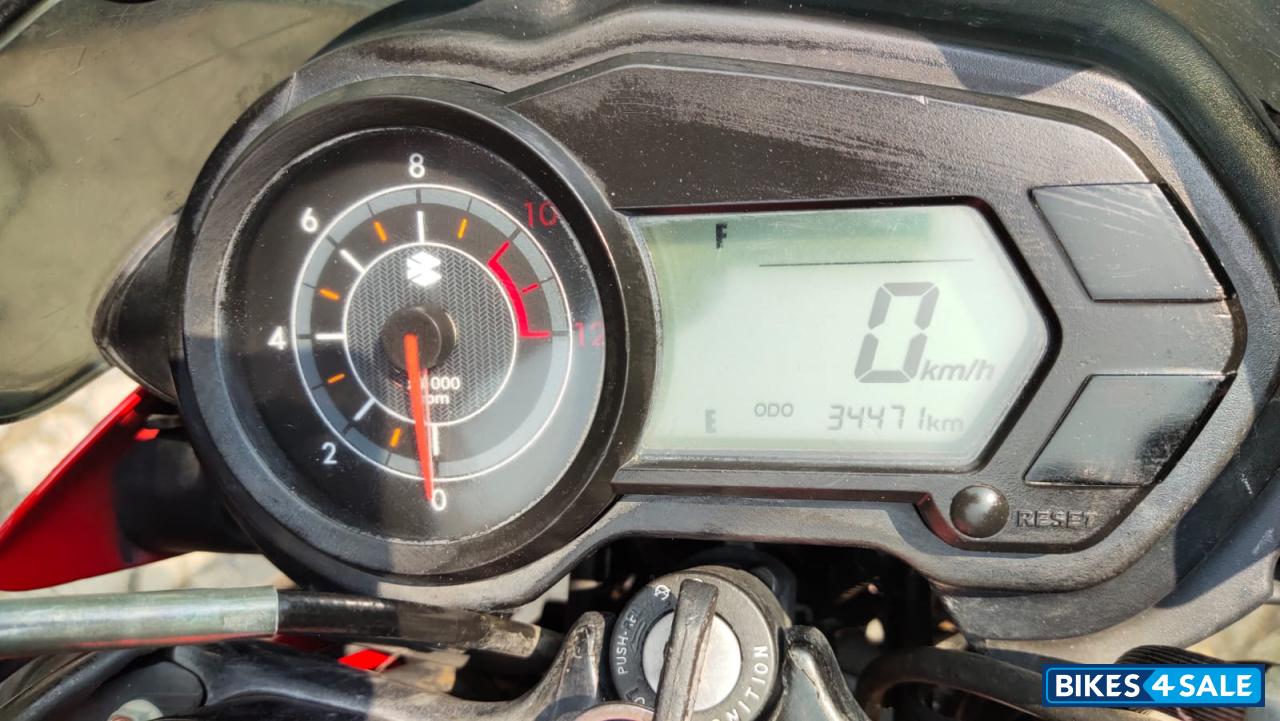 Red-black Bajaj Pulsar 135LS