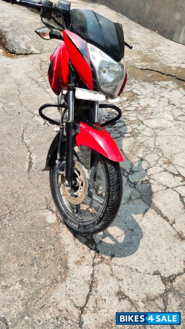 Red-black Bajaj Pulsar 135LS