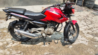Red-black Bajaj Pulsar 135LS