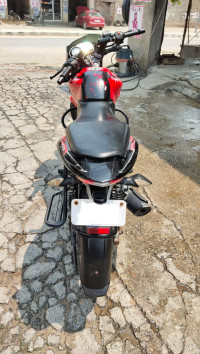 Red-black Bajaj Pulsar 135LS