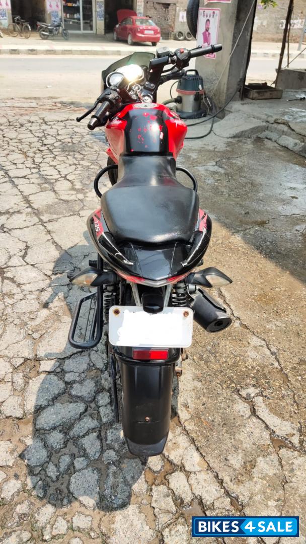Red-black Bajaj Pulsar 135LS