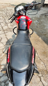 Red-black Bajaj Pulsar 135LS