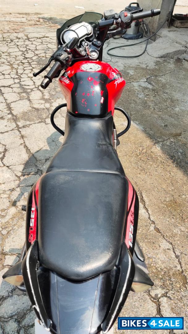 Red-black Bajaj Pulsar 135LS