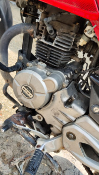 Red-black Bajaj Pulsar 135LS